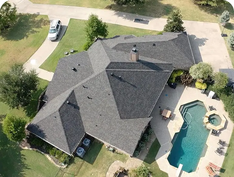 Aerial view of house with swimming pool.
